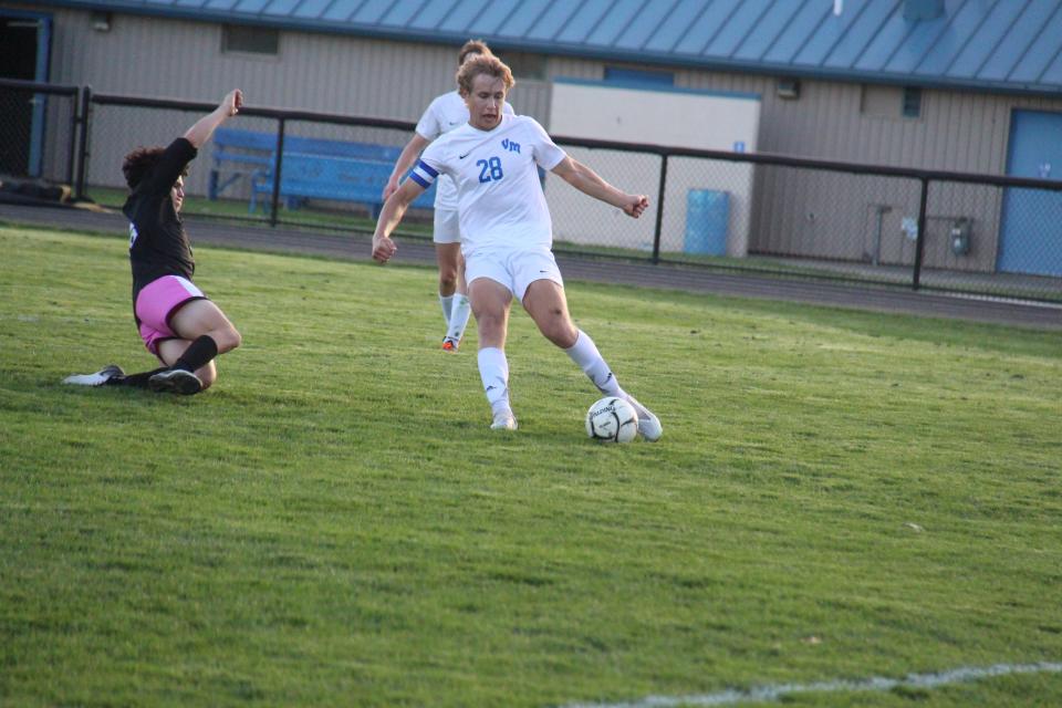 Van Meter's Will Gordon clears the ball during a game against Perry on Monday, May 8, 2023, at Dewey Field.