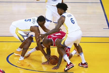 May 20, 2018; Oakland, CA, USA; Houston Rockets forward P.J. Tucker (4) battles for possession below Golden State Warriors forward Kevon Looney (5) and guard Nick Young (6) the third quarter of game three of the Western conference finals of the 2018 NBA Playoffs at Oracle Arena. Mandatory Credit: Kelley L Cox-USA TODAY Sports