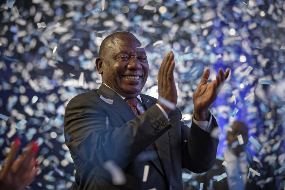 FILE - In this Saturday, May 11, 2019 file photo, President Cyril Ramaphosa applauds as confetti is launched at the end of the election results ceremony at the Independent Electoral Commission Results Center in Pretoria, South Africa. These African stories captured the world's attention in 2019 - and look to influence events on the continent in 2020. (AP Photo/Ben Curtis, File)