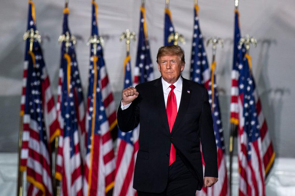 Former President Donald Trump takes the stage at his rally in Des Moines, Iowa, on Sat. Oct. 9, 2021. 