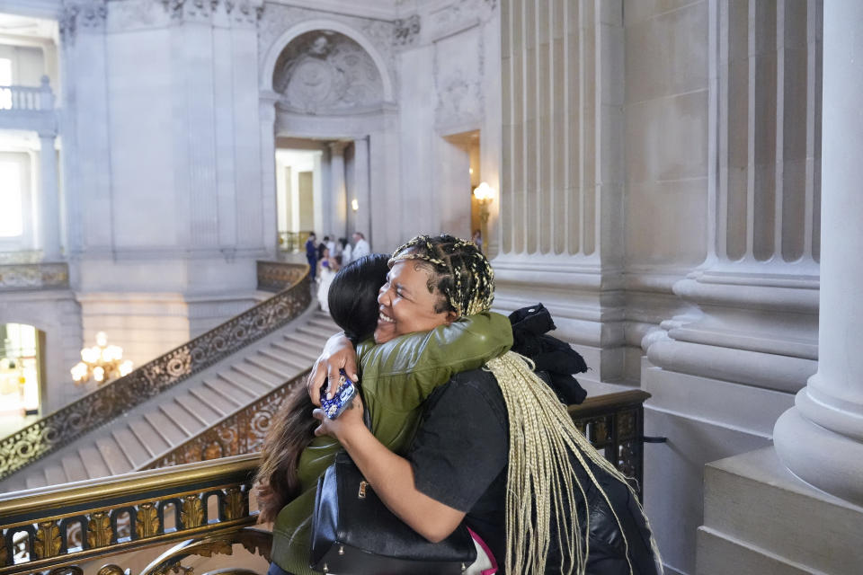 Danica Gutierrez, left, and Christiana Porter hug after they met with politicians at City Hall, Tuesday, May 21, 2024, in San Francisco. Gutierrez, Porter and six other women are part of Family Advisory Committee, a pilot program by San Francisco nonprofit Compass Family Services, working to engage more homeless parents in advocacy as family homelessness surges in the U.S. (AP Photo/Godofredo A. Vásquez)