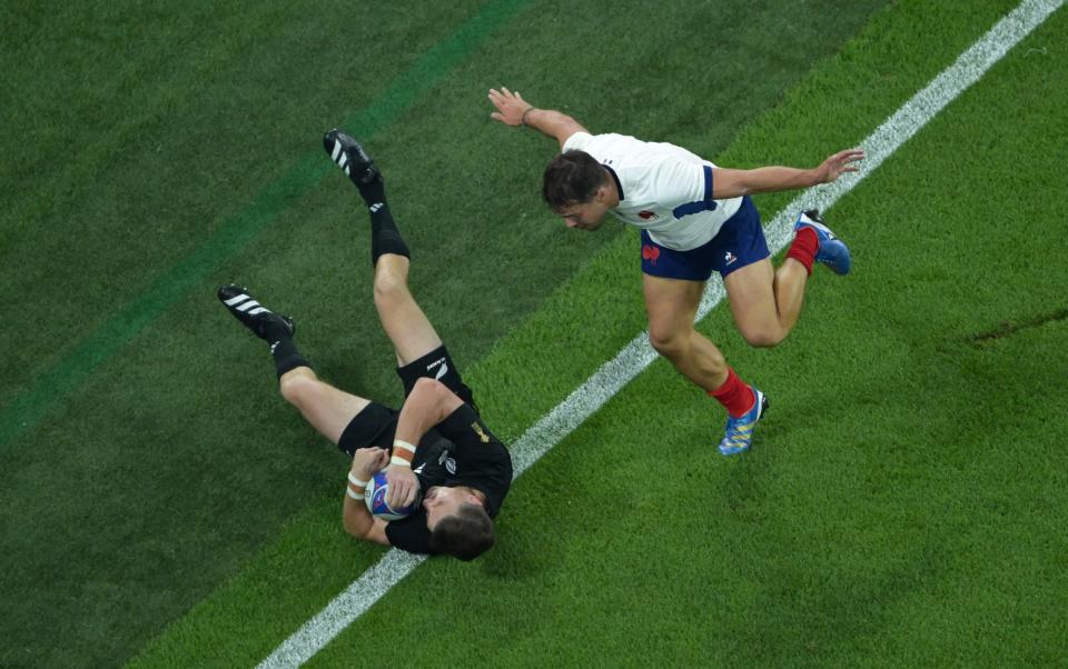 New Zealand's full-back Beauden Barrett fights for the ball with France's scrum-half and captain Antoine Dupont