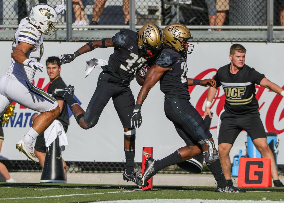 Sep 24, 2022; Orlando, Florida, USA; UCF Knights safety Quadric Bullard (37) scores a touchdown on a Georgia Tech fumble during the second quarter at FBC Mortgage Stadium. Mandatory Credit: Mike Watters-USA TODAY Sports