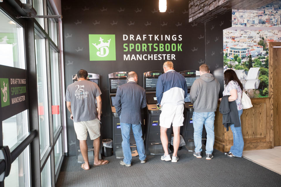 MANCHESTER, NH - SEPTEMBER 13:  People places their bets after the ribbon cutting ceremony of the Grand Opening of DraftKings Sportsbook Manchester on September 2, 2020 in Manchester, New Hampshire.  (Photo by Scott Eisen/Getty Images for DraftKings)