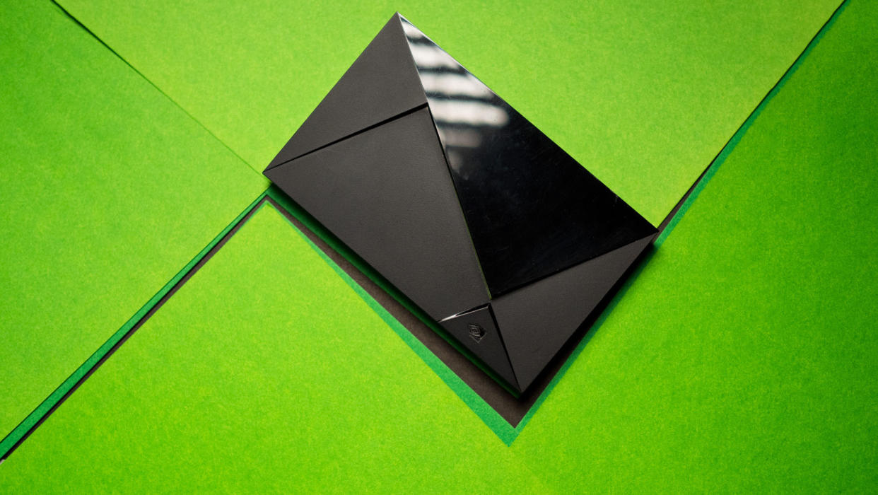  NVIDIA Shield TV Pro against green background. 