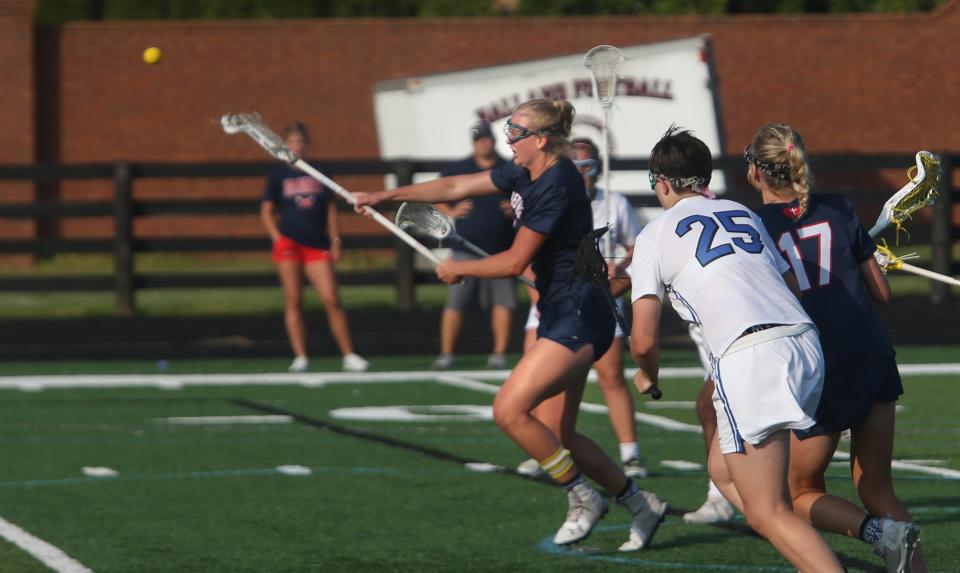 Sacred Heart’s Elizabeth Mueller scores a goal against Eastern in the Kentucky Lacrosse Championship. May 18, 2023