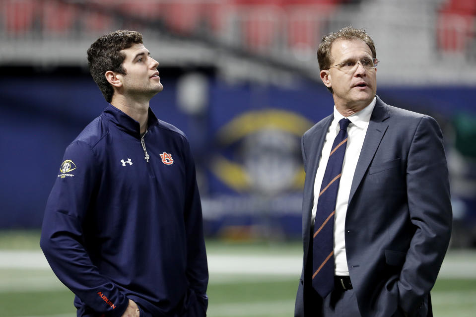 Jarrett Stidham (L) enters his second season as Gus Malzahn’s starting quarterback. (AP Photo)