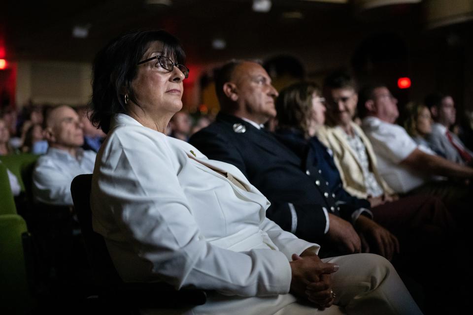 Diane Cotter watches "Burned," a film that tells the story of Cotter's fight to expose PFAS in firefighting gear, June 11, 2023, at the Hanover Theatre.