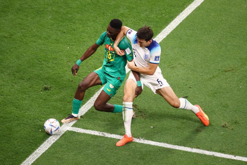 John Stones of England is challenged by Ismaila Sarr of Senegal (Getty)