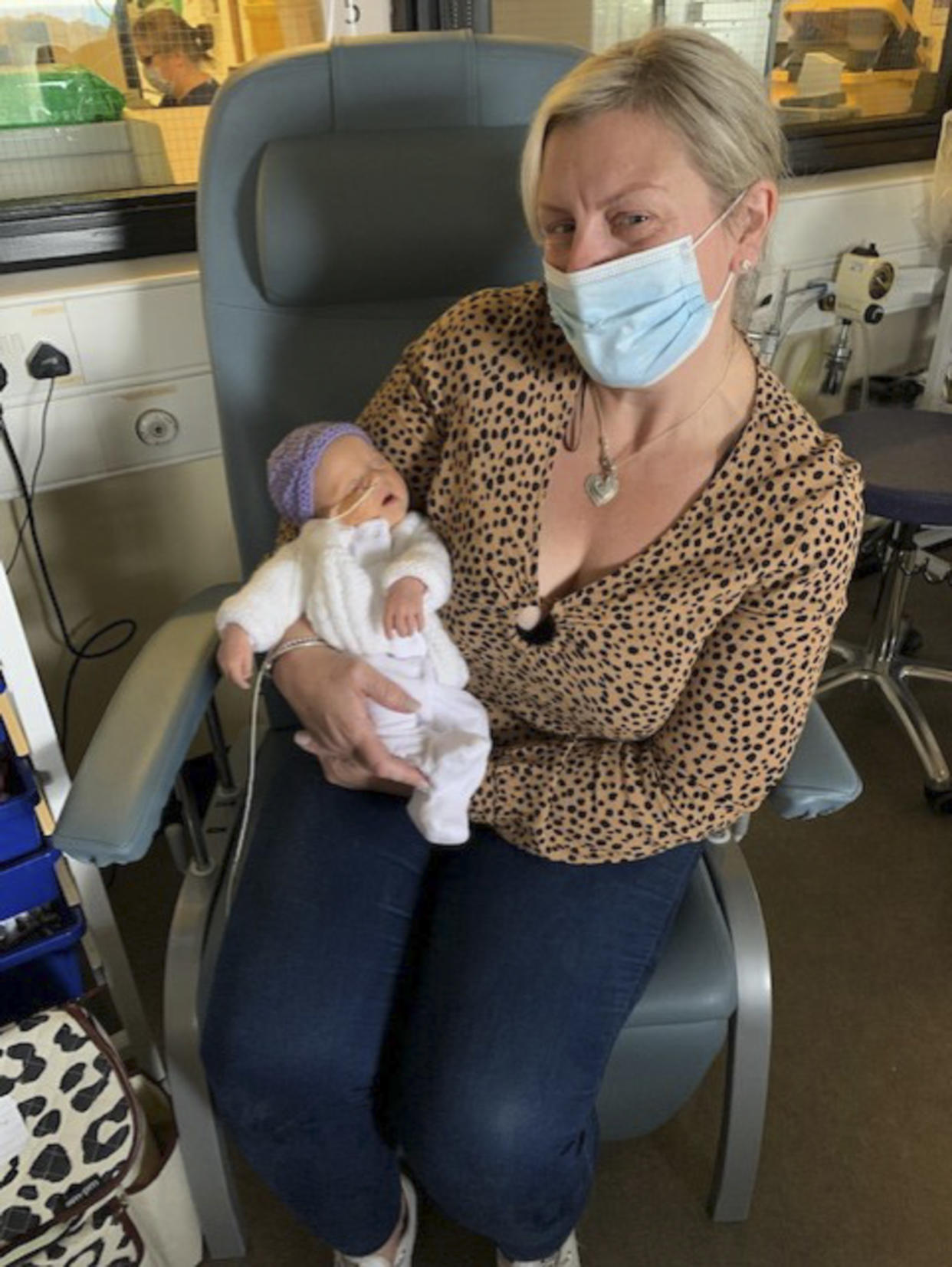 Grandmother Becky Knight meets her granddaughter Betsy. (Caters)