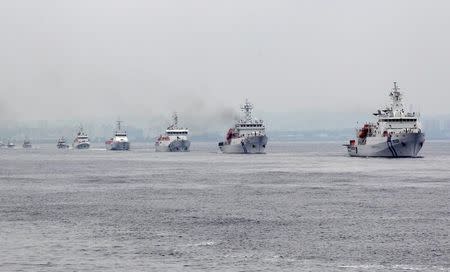 Taiwan Coast Guard patrol ships are seen during a drill held about 4 nautical miles out of the port of Kaohsiung, southern Taiwan, June 6, 2015. REUTERS/Pichi Chuang
