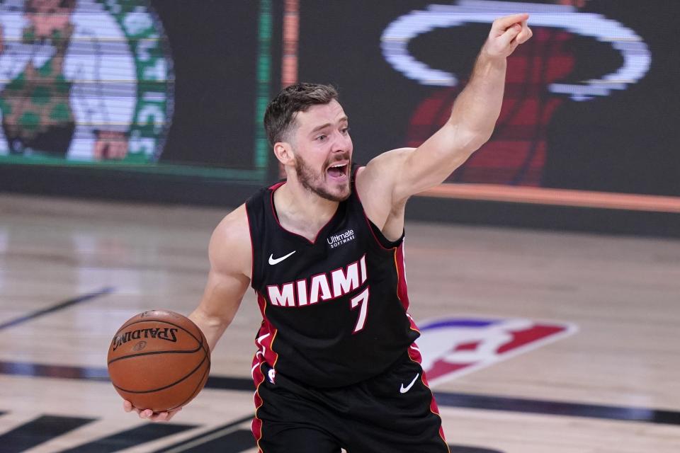 Miami Heat's Goran Dragic (7) gestures as he handles the ball during the first half of an NBA conference final playoff basketball game against the Boston Celtics on Saturday, Sept. 19, 2020, in Lake Buena Vista, Fla. (AP Photo/Mark J. Terrill)