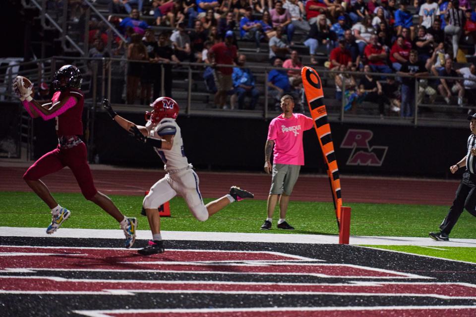 Red Mountain wide receiver Ja'kobi Lane catches the ball and scores a touch down against Mountain View at the Jim Jones Field in Mesa, Ariz. on Friday, Oct. 8, 2021. (Alex Gould/Special to The Republic)