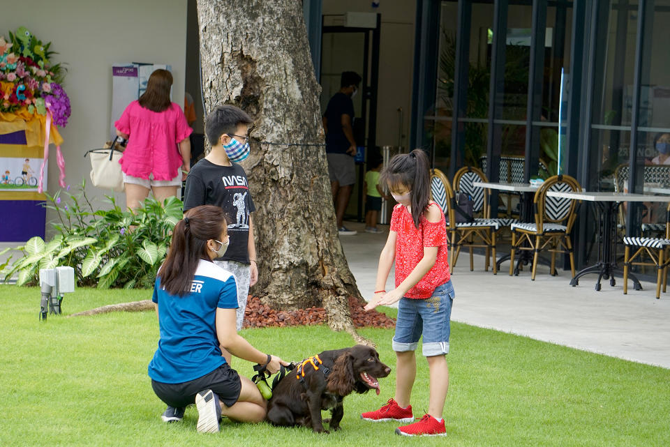 A family with their dog seen at an outdoor cafe at Changi Airport on 11 October 2020. (PHOTO: Dhany Osman / Yahoo News Singapore)