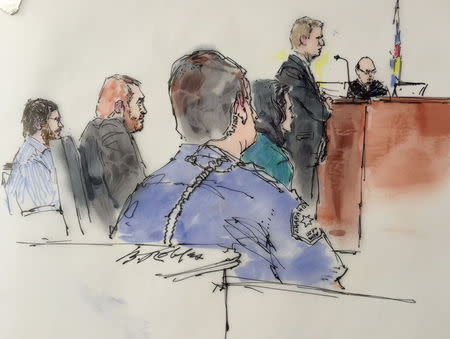 Arapahoe County District Attorney George Brauchler speaks as Defence attorney Dan King (2ndL), James Holmes (L) and Judge Carlos Samour, listen in Arapahoe County District Court in Denver, Colorado on February 11, 2015, in this courtroom sketch. REUTERS/Bill Robles