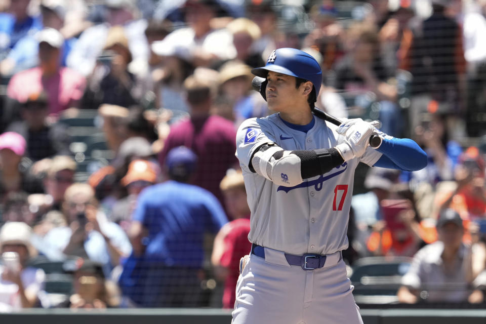 Los Angeles Dodgers' Shohei Ohtani gets ready for an at-bat against the San Francisco Giants during the first inning of a baseball game Sunday, June 30, 2024, in San Francisco. (AP Photo/Godofredo A. Vásquez)