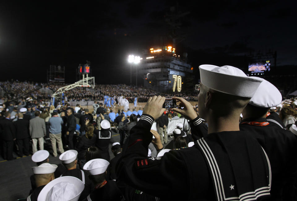 CORONADO, CA - NOVEMBER 11: U.S. Military personnel watch the North Carolina Tar Heels play against the Michigan State Spartans during the Quicken Loans Carrier Classic on board the USS Carl Vinson on November 11, 2011 in Coronado, California. (Photo by Ezra Shaw/Getty Images)