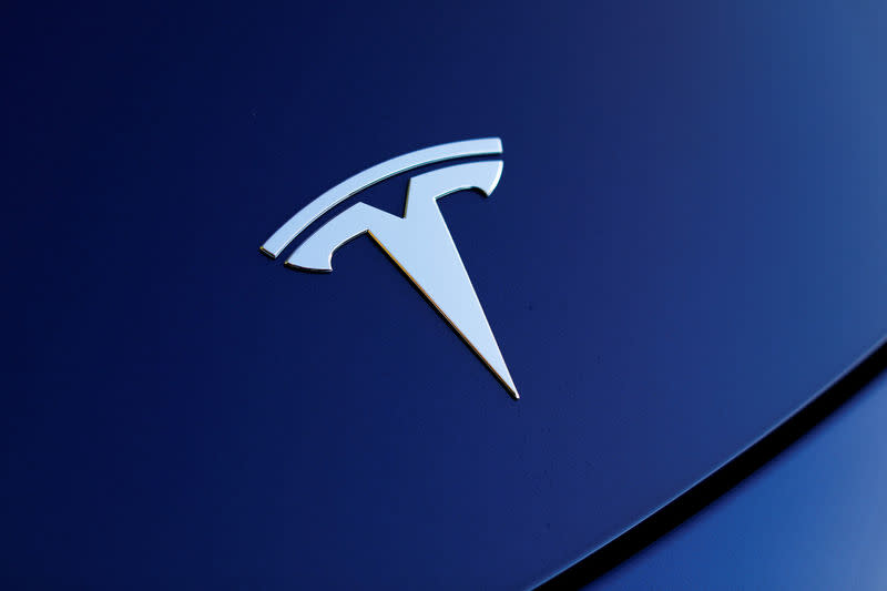 The front hood logo on a 2018 Tesla Model 3 electric vehicle is shown in this photo illustration taken in Cardiff, California, U.S., June 1, 2018. REUTERS/Mike Blake