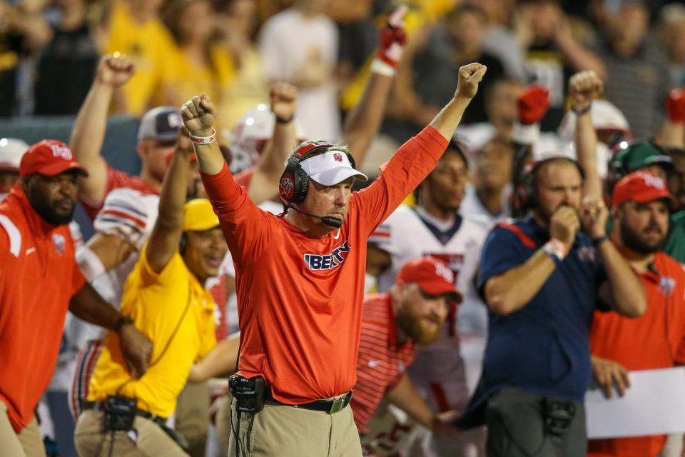 Liberty coach Hugh Freeze celebrates after the Flames stopped Southern Miss on the goal line to defeat the Golden Eagles in overtime in September.