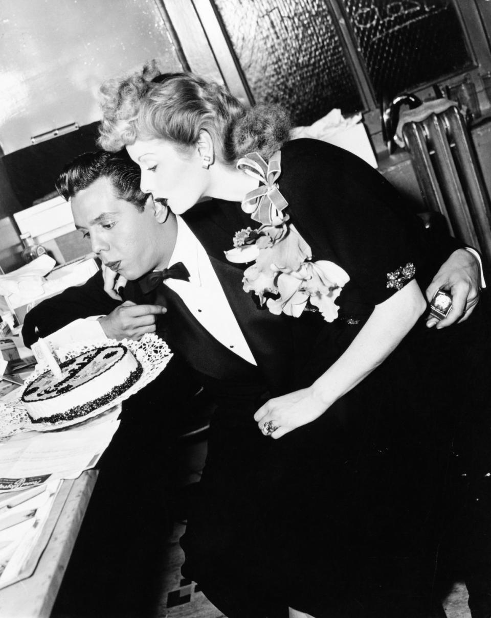 1950: Blowing out candles with her then-husband.