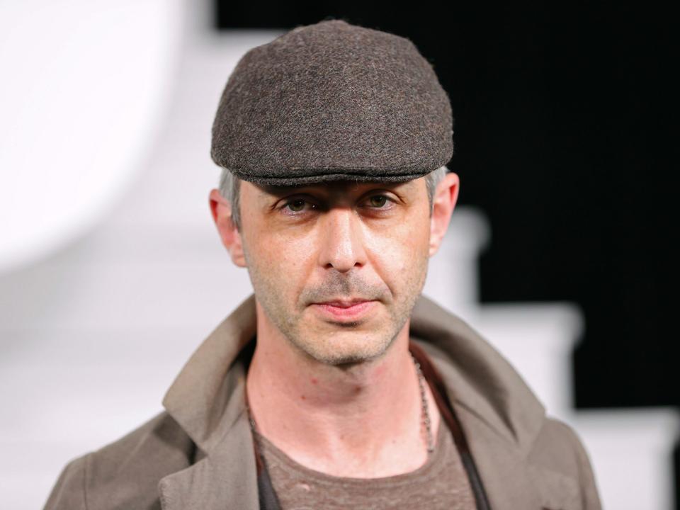 Jeremy Strong in a newsboy cap