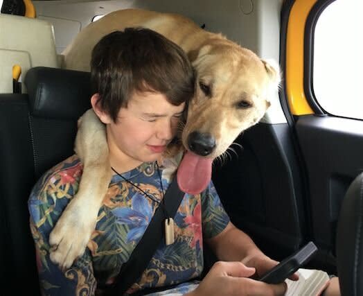 Canyon Mansfield with his beloved dog, Casey, in a photo provided in 2017. Casey was killed by a triggered cyanide bomb, and Canyon was hospitalized. (Photo: Photo courtesy of Theresa Mansfield)