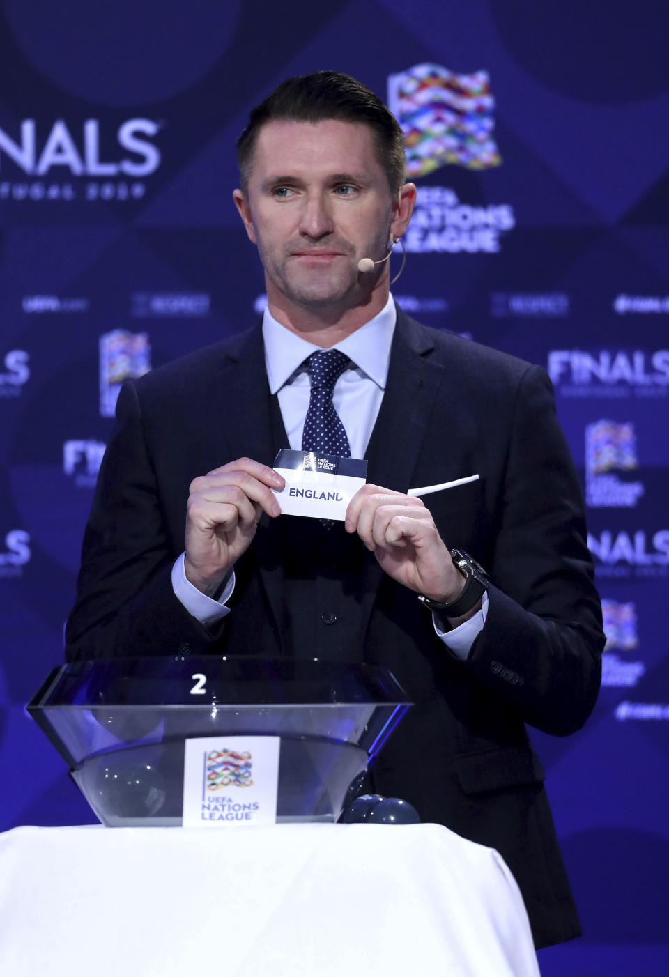 Robbie Keane presents the draw during the UEFA Nations League Finals draw at the Shelbourne Hotel, Dublin, Monday Dec. 3, 2018. (Niall Carson/PA via AP)