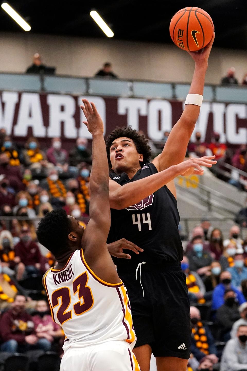 Missouri State forward Gaige Prim, right, shoots over Loyola Chicago forward Chris Knight during the first half of an NCAA college basketball game in Chicago, Saturday, Jan. 22, 2022. (AP Photo/Nam Y. Huh)