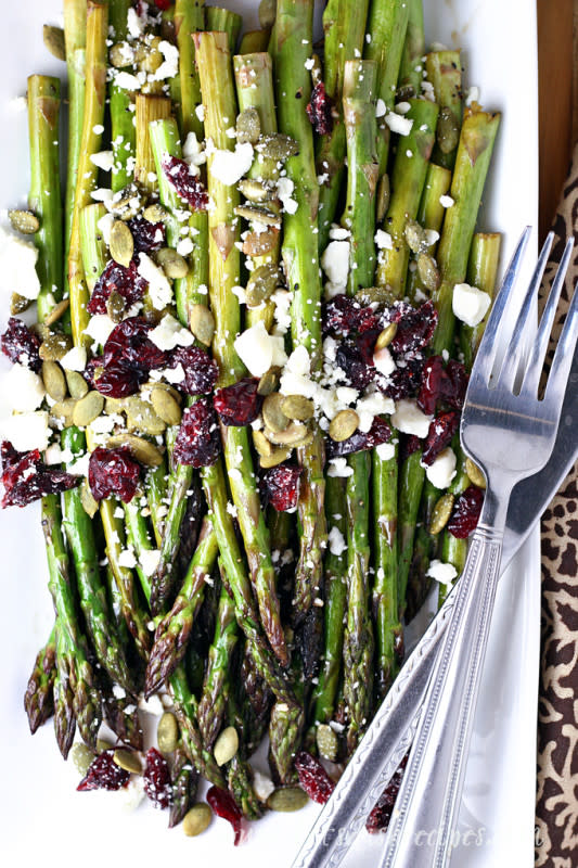 <p>Let's Dish Recipes</p><p>The sweet and tangy glaze makes this dish simple and fancy. </p><p><strong>Get the recipe: <a href="https://letsdishrecipes.com/2018/11/maple-balsamic-roasted-asparagus-with-cranberries-and-feta.html" rel="nofollow noopener" target="_blank" data-ylk="slk:Maple Balsamic Roasted Asapragus with Cranberries and Feta;elm:context_link;itc:0;sec:content-canvas" class="link rapid-noclick-resp">Maple Balsamic Roasted Asapragus with Cranberries and Feta</a></strong> </p>