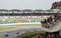 Crowds in the grandstands during the Moto GP race at Sepang in Malaysia. Shot with the 18-200mm F3.5-6.3 lens. Focal length 36mm, exposure 1/1250 sec; f/4.5; ISO 125, Shutter priority mode.