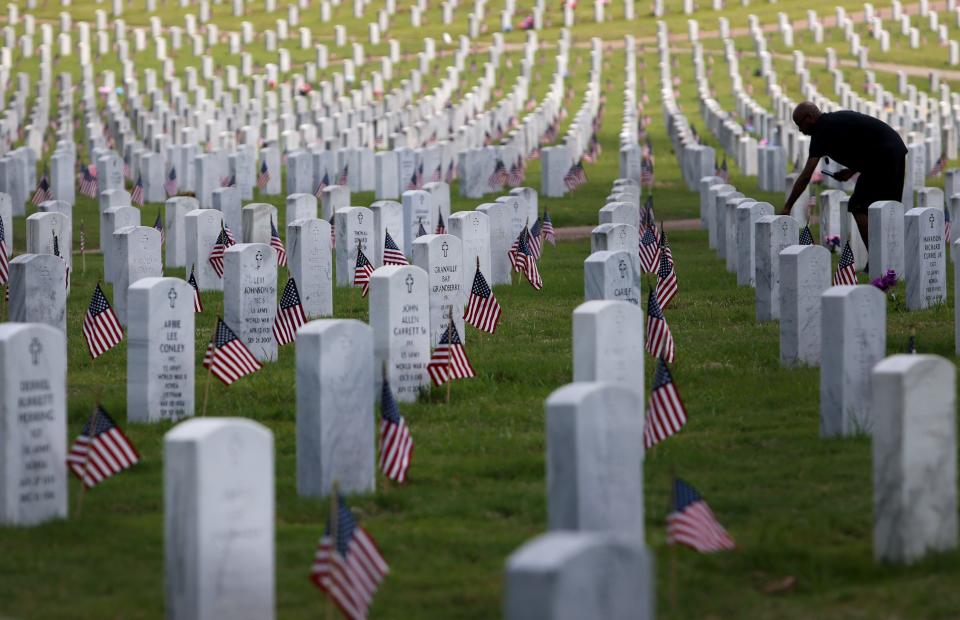 People gather Monday, May 30, 2022 at the West Tennessee Veterans Cemetery in remembrance of fallen U.S. soldiers to honor Memorial Day. 