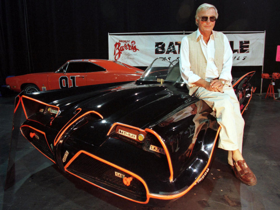 Adam West sits atop the original Batmobile at RetroFest, 1999