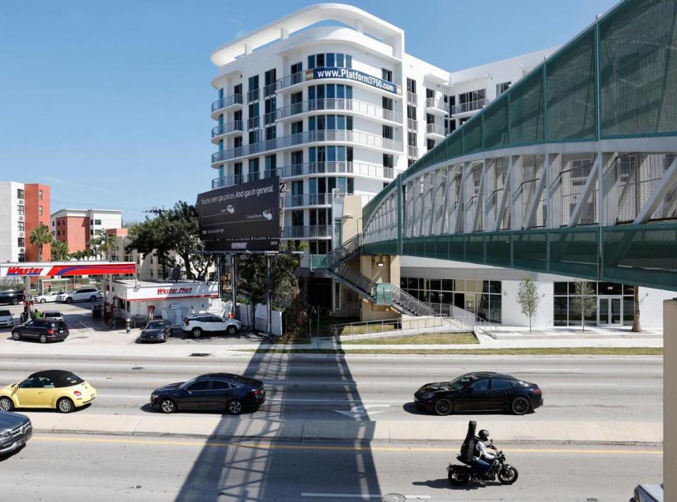 A pedestrian bridge over U.S. 1 connects the new Platform 3750 apartment and retail complex in Coconut Grove, which includes affordable units and an Aldi grocery store, to the Douglas Road Metrorail Station, the hub of a new urban neighborhood.