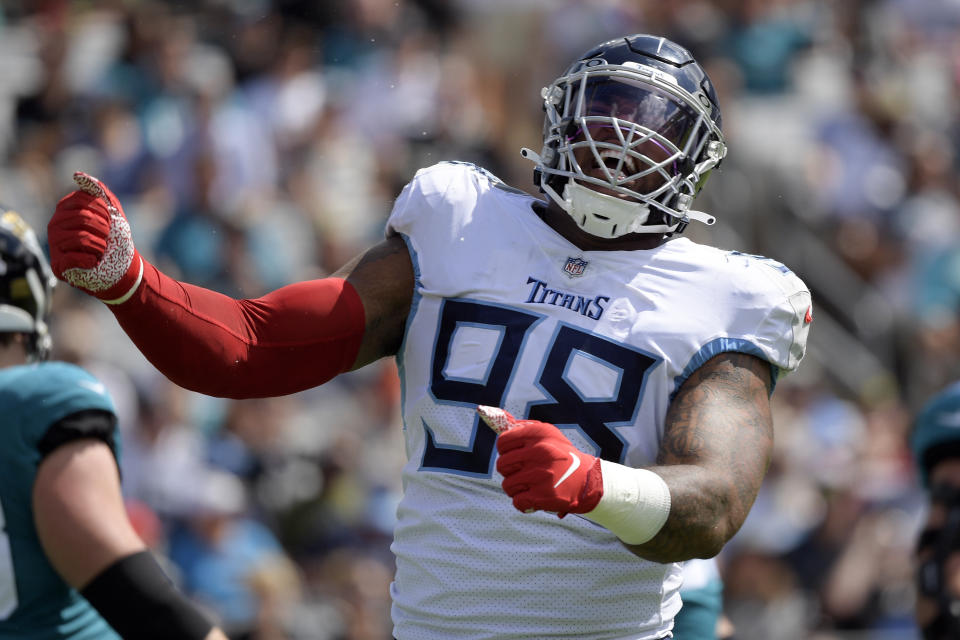 Tennessee Titans defensive end Jeffery Simmons (98) celebrates after making a play against the Jacksonville Jaguars during the first half of an NFL football game, Sunday, Oct. 10, 2021, in Jacksonville, Fla. (AP Photo/Phelan M. Ebenhack)