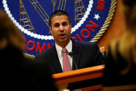 Chairman Ajit Pai speaks ahead of the vote on the repeal of so called net neutrality rules at the Federal Communications Commission in Washington, U.S., December 14, 2017. REUTERS/Aaron P. Bernstein