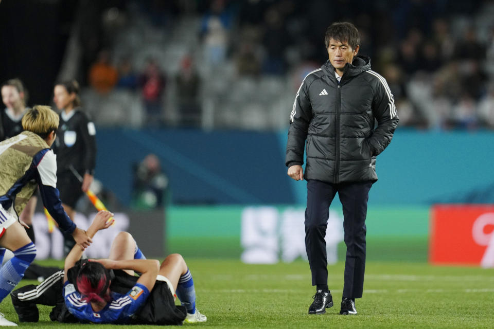 Japan's head coach Futoshi Ikeda walks on the pitch at the end of the Women's World Cup quarterfinal soccer match between Japan and Sweden at Eden Park in Auckland, New Zealand, Friday, Aug. 11, 2023. Sweden won 2-1. (AP Photo/Abbie Parr)