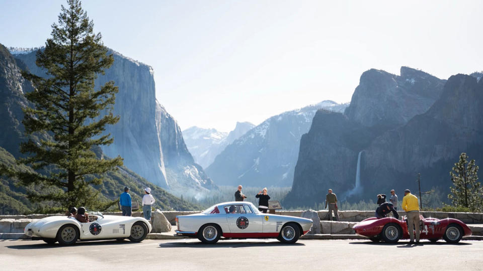 Participants in the California Mille classic-car tour stop to take in a classic view of Yosemite National Park.