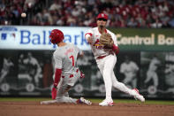 Philadelphia Phillies' Trea Turner (7) is out at second as St. Louis Cardinals shortstop Masyn Winn turns the double play during the sixth inning of a baseball game Tuesday, April 9, 2024, in St. Louis. The Phillies' Bryce Harper was out at first. (AP Photo/Jeff Roberson)