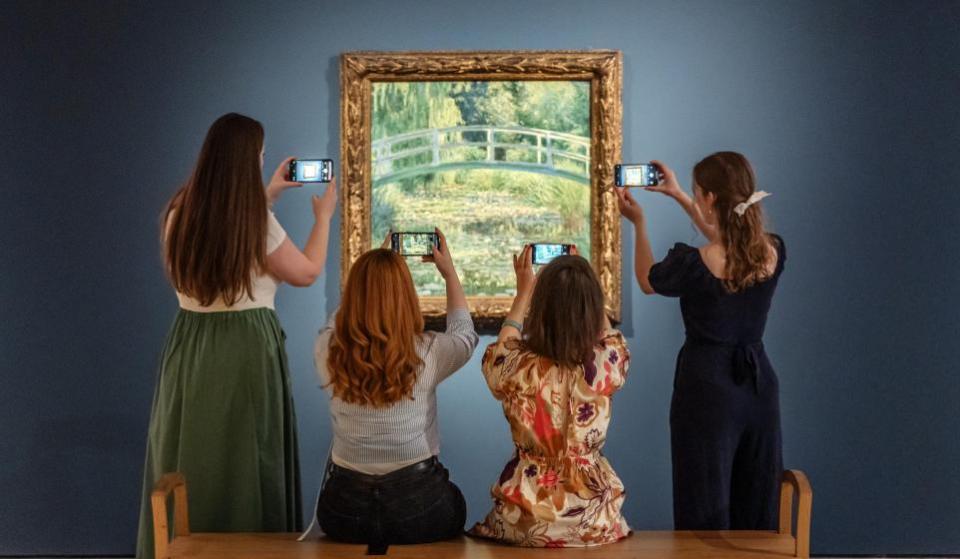 York Press: People photograph Monet's 'The Water-Lily Pond' at York Art Gallery