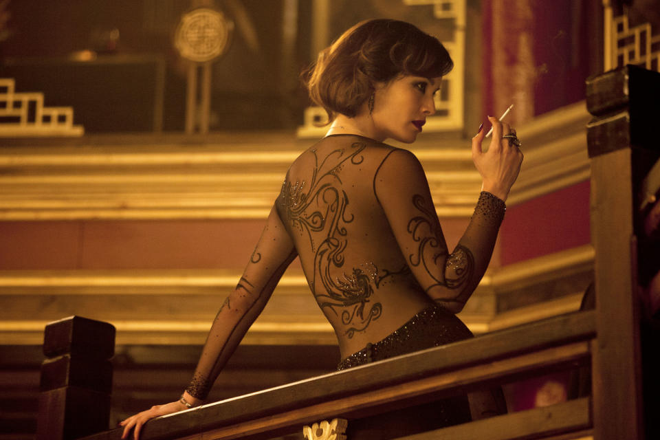 This film image released by Sony Pictures shows Berenice Marlohe in a scene from the film "Skyfall." Costume designer Jany Temime says her mantra for the entire wardrobe of “Skyfall,” which opens Friday, was “iconic for 2012.” For Marlohe, Temime envisioned an Ava Gardner type. She required two knockout gowns, one a second-skin L'Wren Scott number that Marlohe had to be sewn into each morning, and a red, slinky Donna Karan. (AP Photo/Sony Pictures, Francois Duhamel)