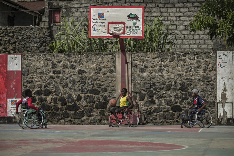 Paul Mitemberezi, a market vendor who has been disabled since he was 3 because of polio, plays basketball at the North Kivu Paralympic League, in Goma, democratic Republic of Congo, Tuesday Jan. 17, 2023. When Pope Francis arrives in Congo and South Sudan Jan. 31, thousands of people will take special note of a gesture more grounded than the sign of the cross. Watching from their wheelchairs, they will relate to the way he uses his. (AP Photo/Moses Sawasawa)