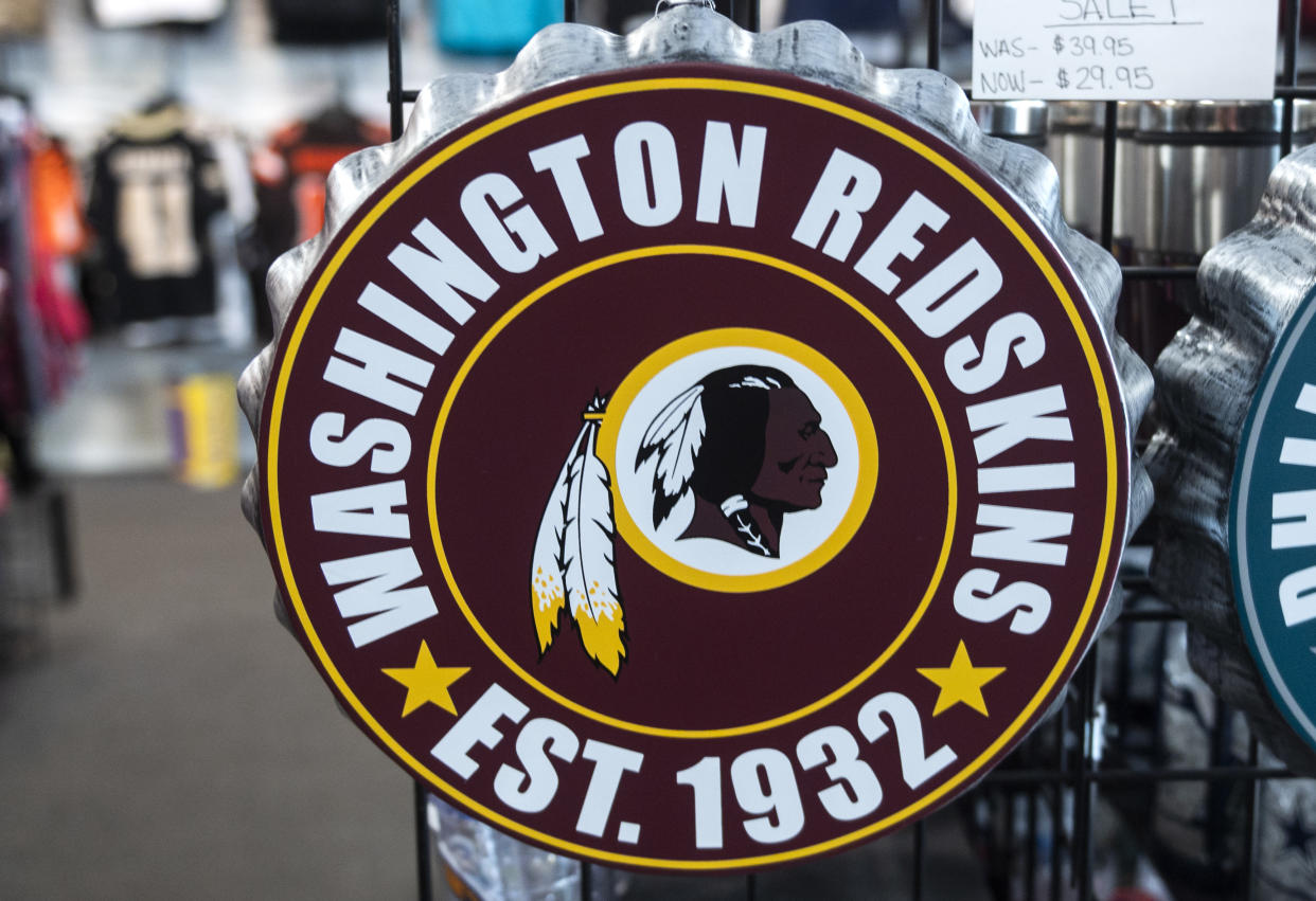Washington Redskins merchandise is seen for sale at a sports store in Fairfax, Virginia on July 13, 2020. - The Washington Redskins confirmed on July 13 that the team is changing its name following pressure from sponsors over a word widely criticized as a racist slur against Native Americans. (Photo by ANDREW CABALLERO-REYNOLDS / AFP) (Photo by ANDREW CABALLERO-REYNOLDS/AFP via Getty Images)