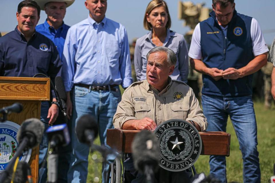 Gov. Greg Abbott, backed by other Republican governors, Texas National Guard leaders, and law enforcement officers, speaks at a press conference on the U.S. southern border in Mission, Texas, on Oct. 6, 2021. Aaron E. Martinez/American-State/USA TODAY NETWORK