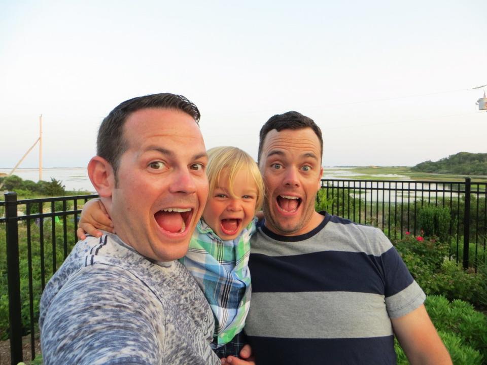 LeeMichael McLean and Bryan Furze pose with their son. During more than five years of harassment, about 30 pieces of mail with homophobic fake names on them were sent to the couple’s home in Milton, Massachusetts.