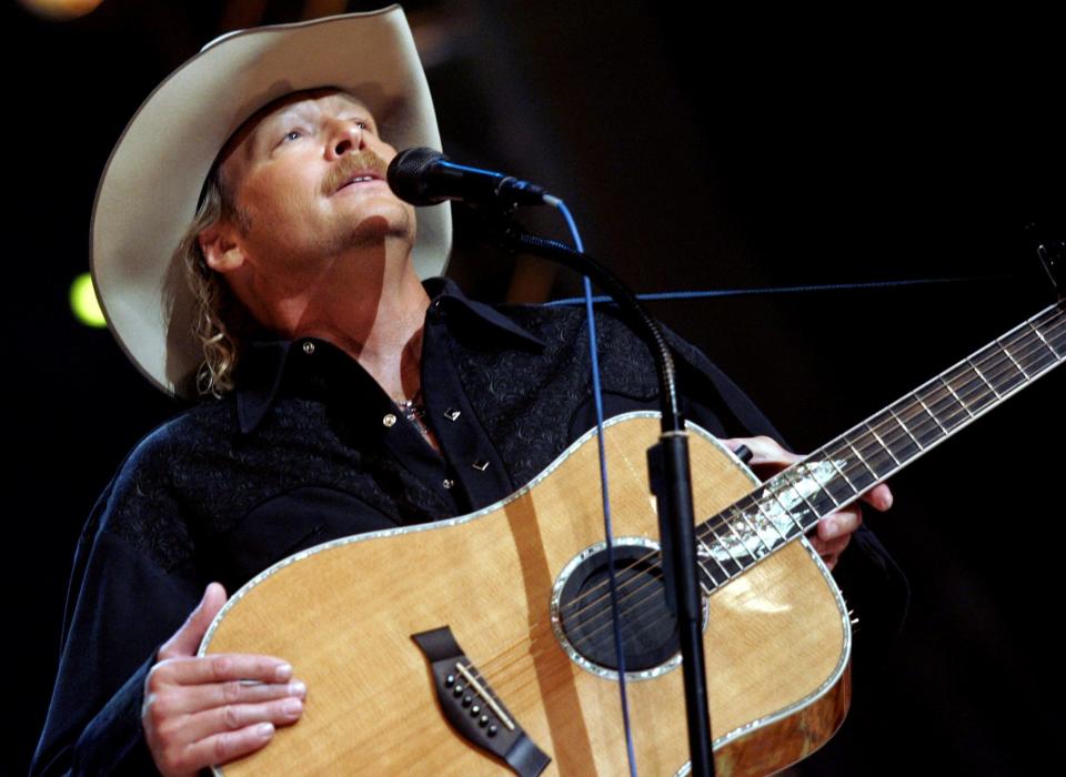Alan Jackson performs during the Country Reaches Out, an Grand Ole Opry Benefit for the American Red Cross at the Opry House Sept. 27, 2005.
