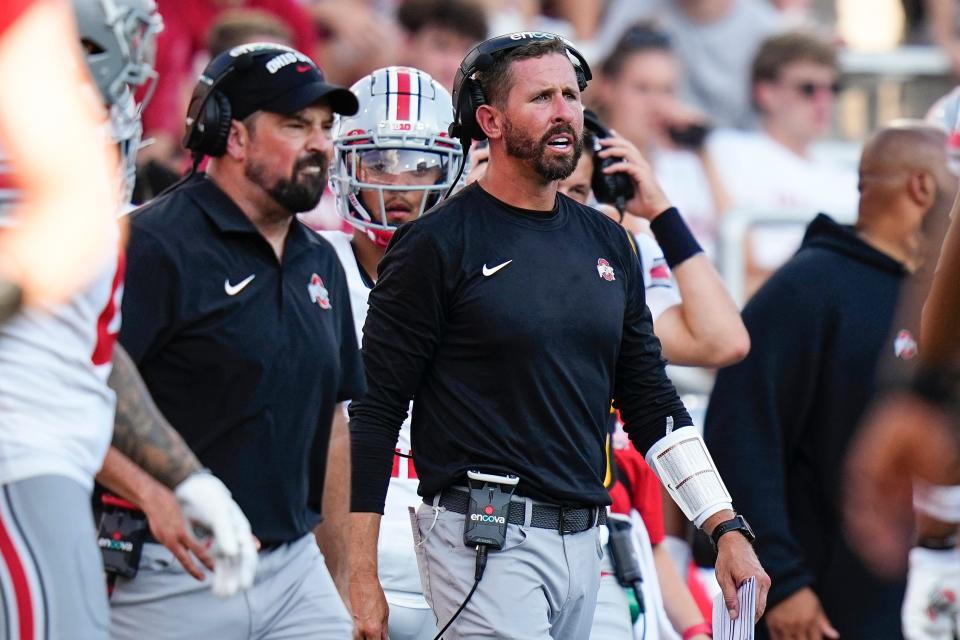 Sep 2, 2023; Bloomington, Indiana, USA; Ohio State Buckeyes head coach Ryan Day and offensive coordinator Brian Hartline yell from the sideline during the NCAA football game at Indiana University Memorial Stadium. Ohio State won 23-3.