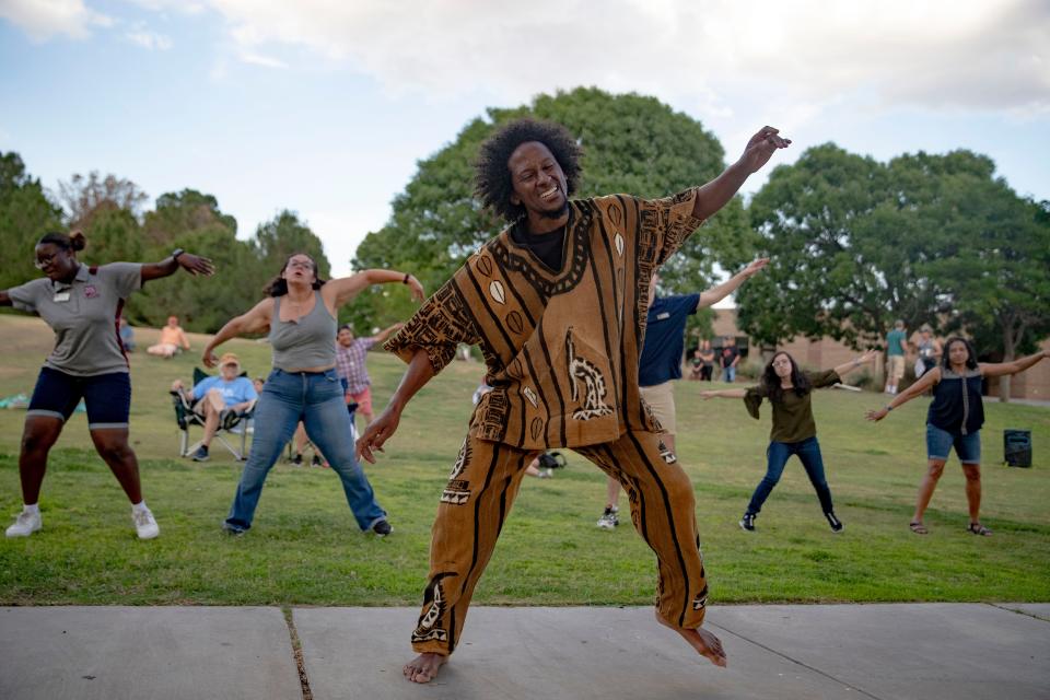 Community members dance during NMSU's Juneteenth celebration at the Corbett Center Student Union outdoor stage on Friday, June 17, 2022.