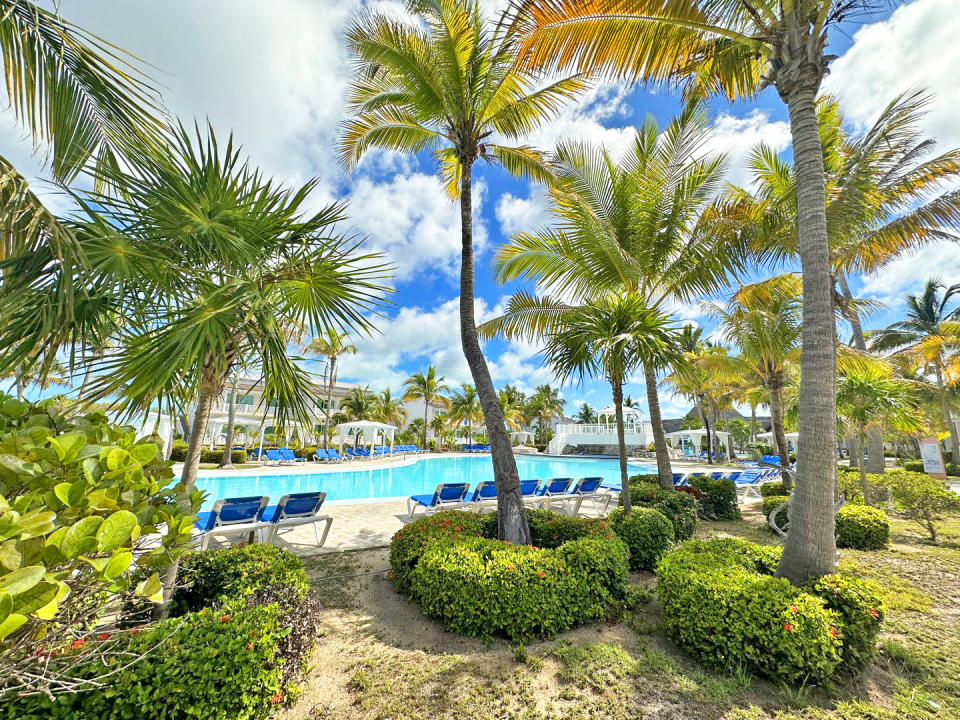 A view of the pool and surrounding palm trees at one of Sunwing's Cayo Largo resorts