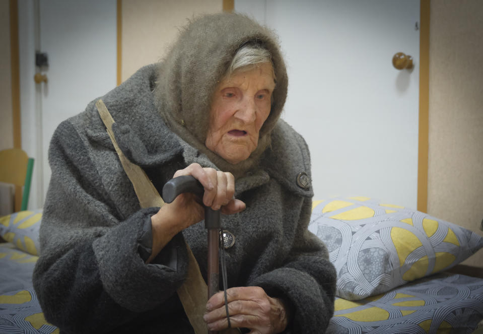 In this photo provided by the Ukrainian National Police of Donetsk region, 98-year-old Lidia Lomikovska sits in a shelter after she escaped Russian-occupied territory in the Donetsk region, Ukraine, April 26, 2024. Lomikovska left the frontline town of Ocheretyne last week by walking almost 10 km (6 miles) alone, after Russian troops entered it and fighting intensified. (Ukrainian National Police of Donetsk region via AP)