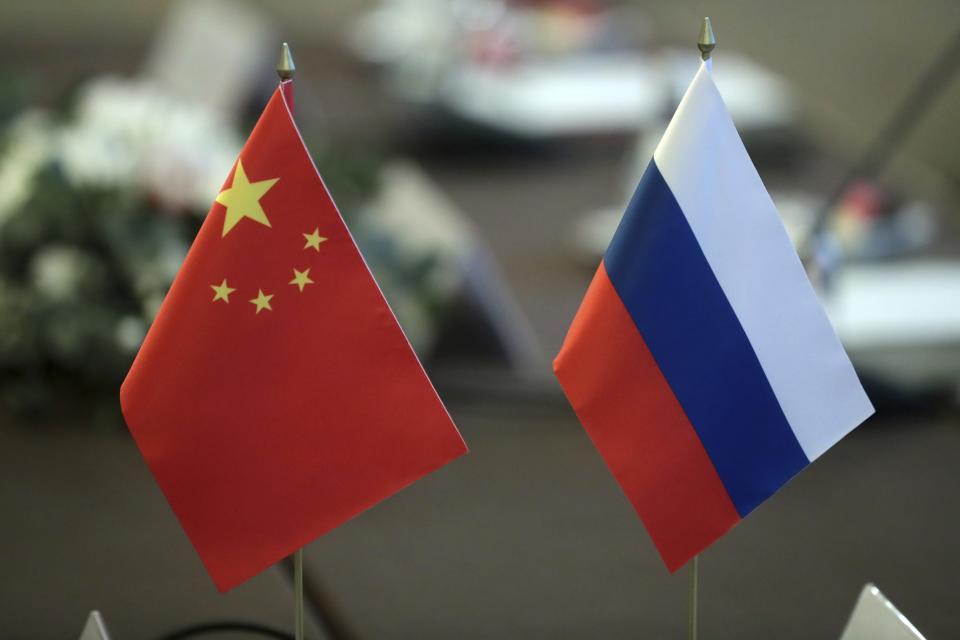 Russia and China flags at a meeting of Russian Security Council Secretary Nikolai Patrushev with Chinese Central Foreign Affairs Commission Director Wang Yi, in Moscow, Feb. 21, 2023.<span class="copyright">Vitaliy Belousov—Sputnik/AP</span>